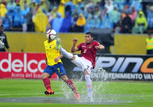 Bolivia's Juan Carlos Zampiery attempts to get to the ball ahead of Ecuador's Jefferson Montero ...