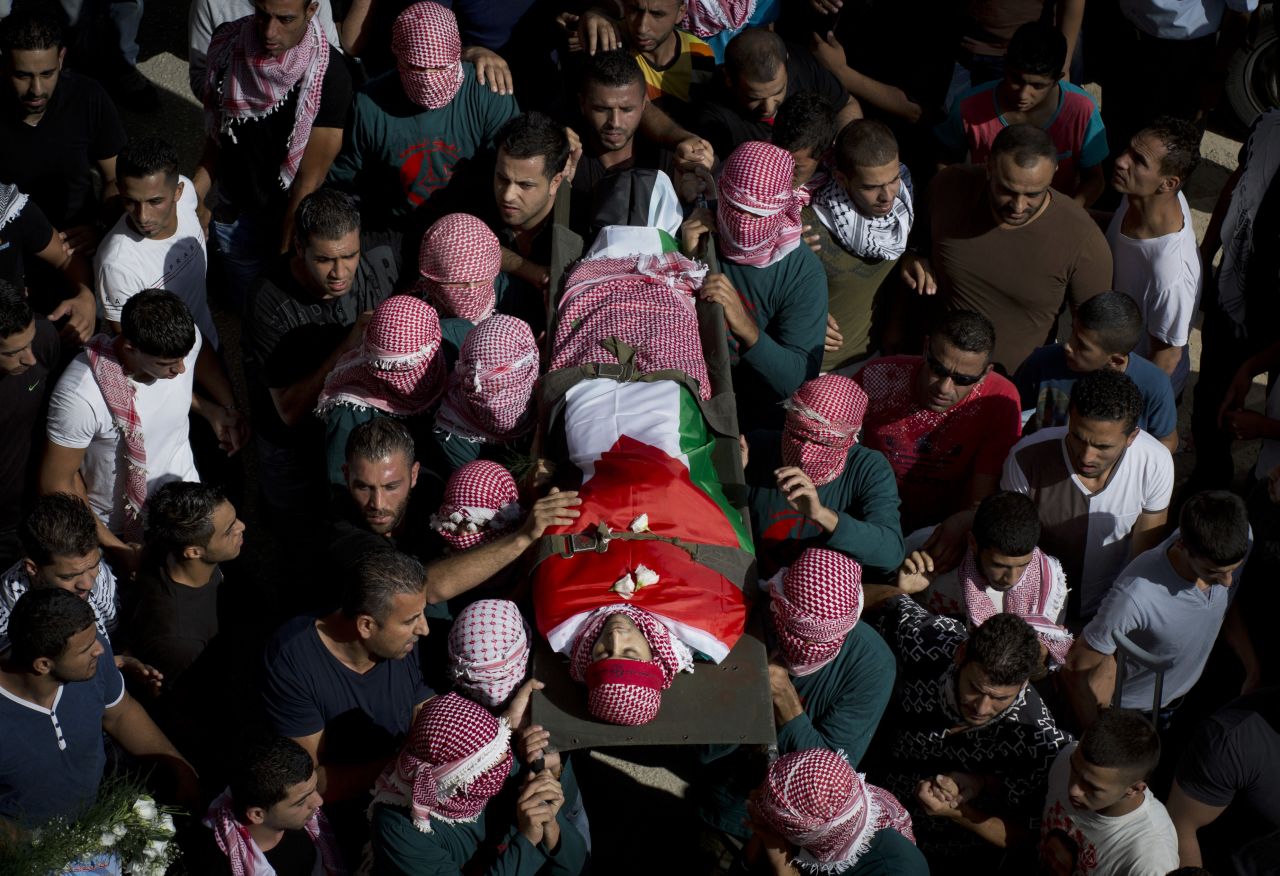 Palestinian mourners carry Zawahra's body on October 14.