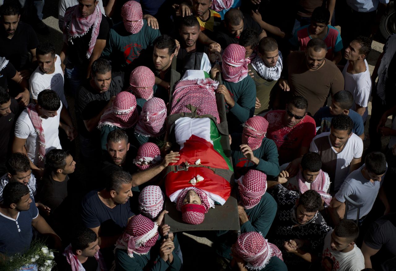 Palestinian mourners carry Zawahra's body on October 14.