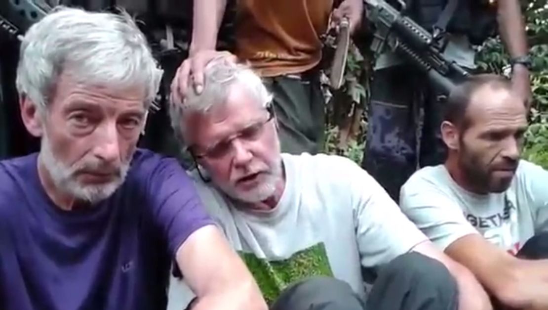 Three men, who appear to be hostages Robert Hall, John Ridsdel and Kjartan Sekkingstad (l-r), are seen in this video screengrab 