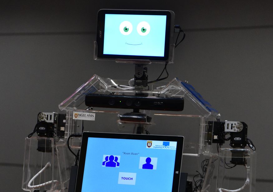 This smiley face belongs to Robocoach, an  exercise robot being rolled out in Singapore senior centers. It has two screens: One for motivation, the other for guidance.