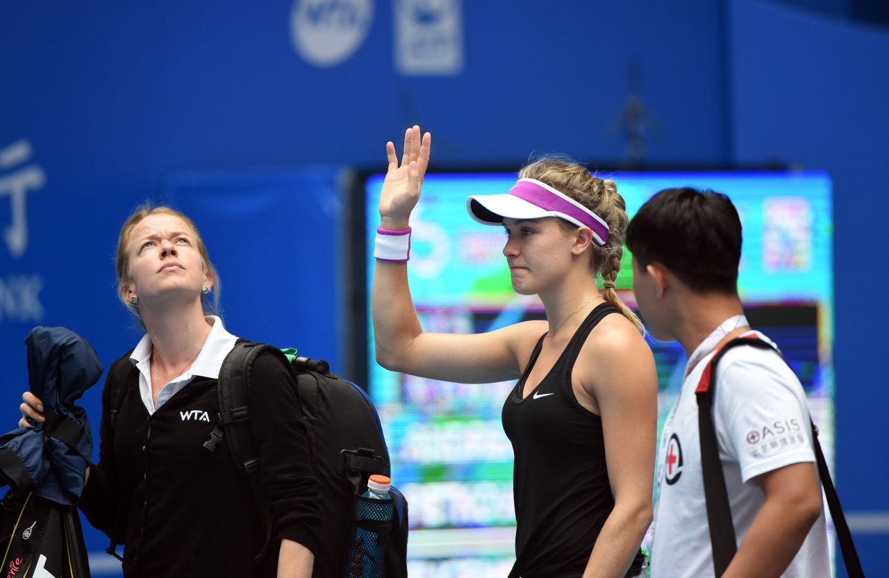 An emotional Bouchard waved to the crowd in Beijing as she exited. 