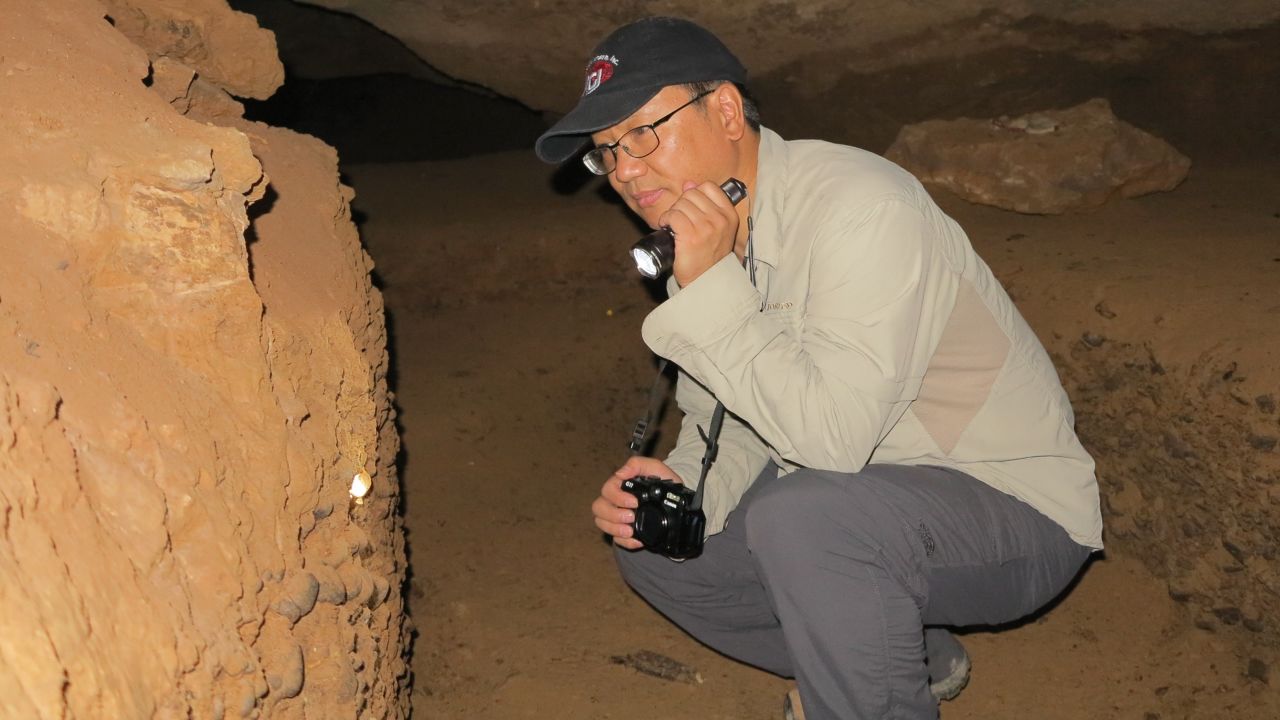 One of the lead researchers, Liu Wu, on an excavation trip to the Daoxian cave in 2014.