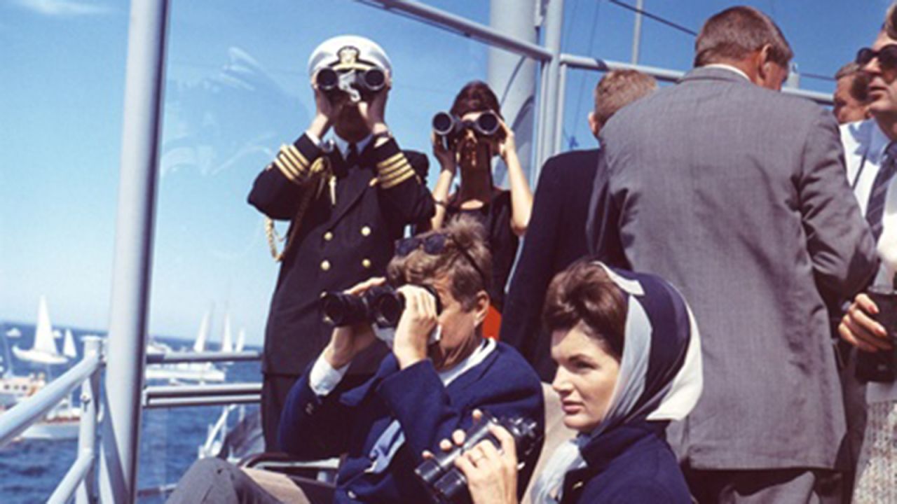 President and Mrs. Kennedy observe the America's Cup race off Newport, Rhode Island.