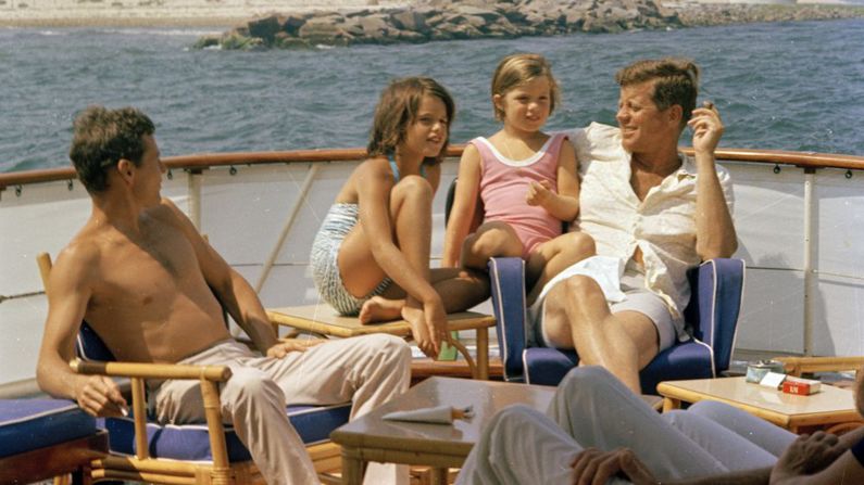 Kennedy sits with Caroline, brother-in-law Steve Smith and niece, Maria Shriver, aboard the presidential yacht Honey Fitz near Hyannis Port, Massachusetts.
