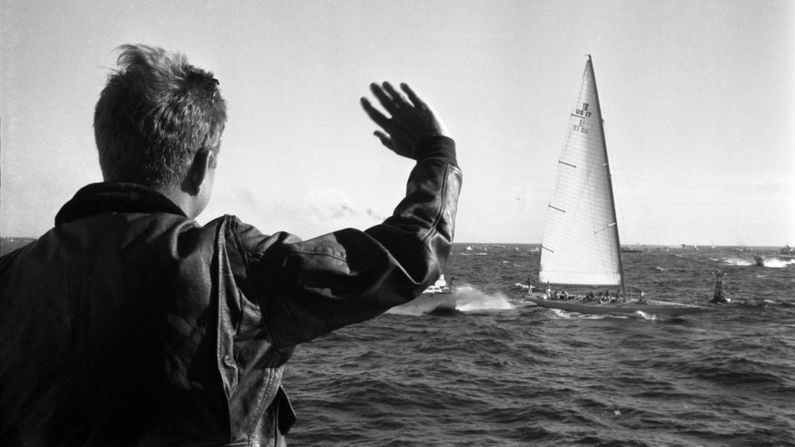President John F. Kennedy watches the first race of the 1962 America's Cup off the coast of Newport, Rhode Island.