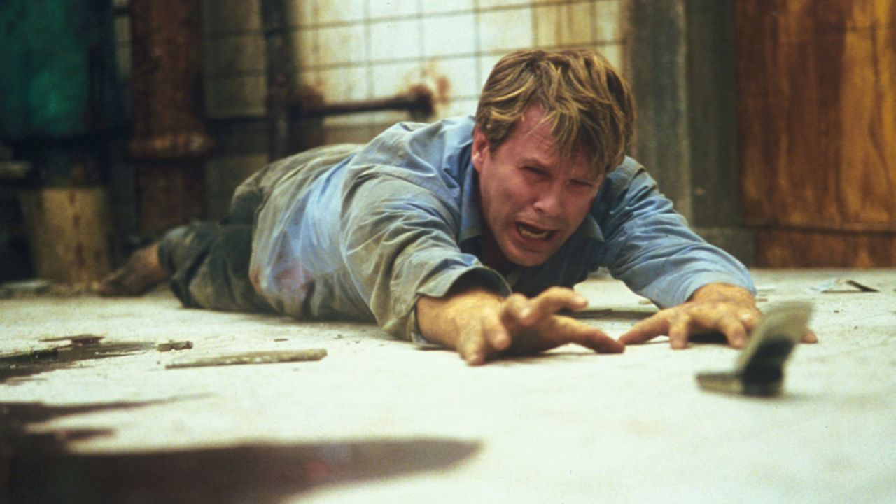 "Saw" brought mass-market horror films a new level of graphic intensity. In the 2004 film, two men are chained in a bathroom, with each directed to kill the other. Its success led to six sequels and other films determined to out-gross the last -- in more ways than one.