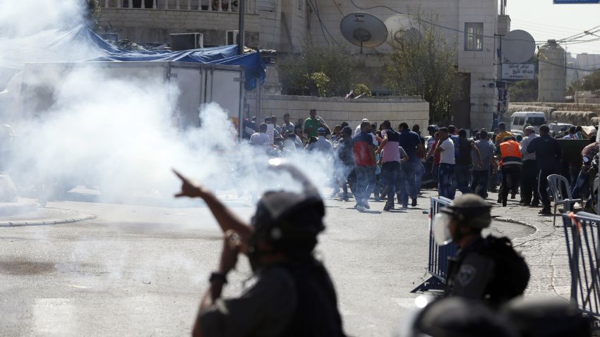 Israeli security forces fire tear gas canisters and stun grenades towards Palestinian protesters after the Friday prayers in the Ras al-Amud neighbourhood in east Jerusalem, on October 16, 2015. Palestinians called for a "Friday of revolution" against Israel, and Jerusalem police barred men under 40 from attending the main weekly prayers at the flashpoint Al-Aqsa mosque, seeking to keep young protesters away. 