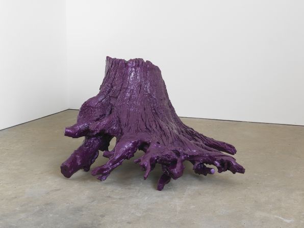 "Iron Root" by Ai Weiwei, a cast iron sculpture of a tree root sprayed in purple car paint, closely connected to the trees currently on display at the Royal Academy of Arts in London.