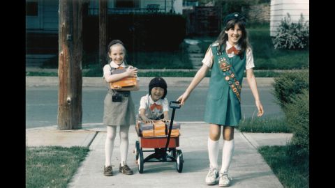 <strong>1980s:</strong> A Girl Scout Junior helps Girl Scout Brownies with cookie deliveries, circa 1984. "Cookies are so much more than a fundraiser," says psychologist Andrea Bastiani Archibald, the Girl Scouts' chief girls expert. "When someone buys a box of cookies, they're helping girls develop their financial literacy skills, their social skills ... and their business ethics. Girls  can carry these skills into the rest of their lives." 