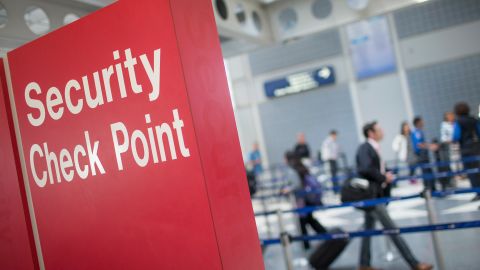 A sign directs travelers to a security checkpoint staffed by Transportation Security Administration workers at O'Hare Airport on June 2, 2015 in Chicago.