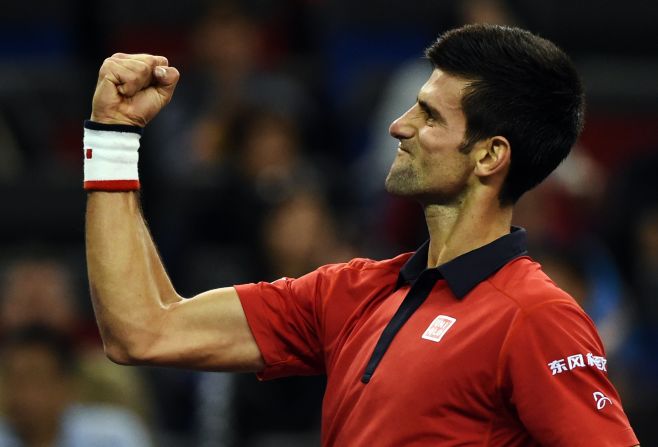 Novak Djokovic  celebrates after winning his semi-final match against Andy Murray at the Shanghai Masters.