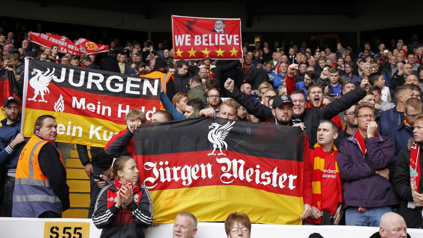 Liverpool supporters hold up banners in support of their new manager Jurgen Klopp.