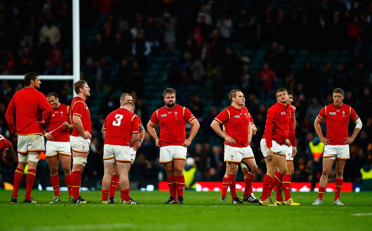 The Wales team look dejected at the full time whistle.