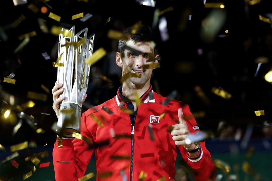 Novak Djokovic of Serbia poses with the winner's trophy after defeating Jo-Wilfried Tsonga of France in the title match at the Shanghai Masters. 