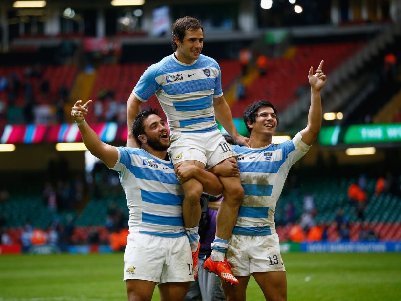 Nicolas Sanchez is lifted on the shoulders of his Argentina teammates Lucas Noguera and Matias Moroni after a superb victory over Ireland.  
