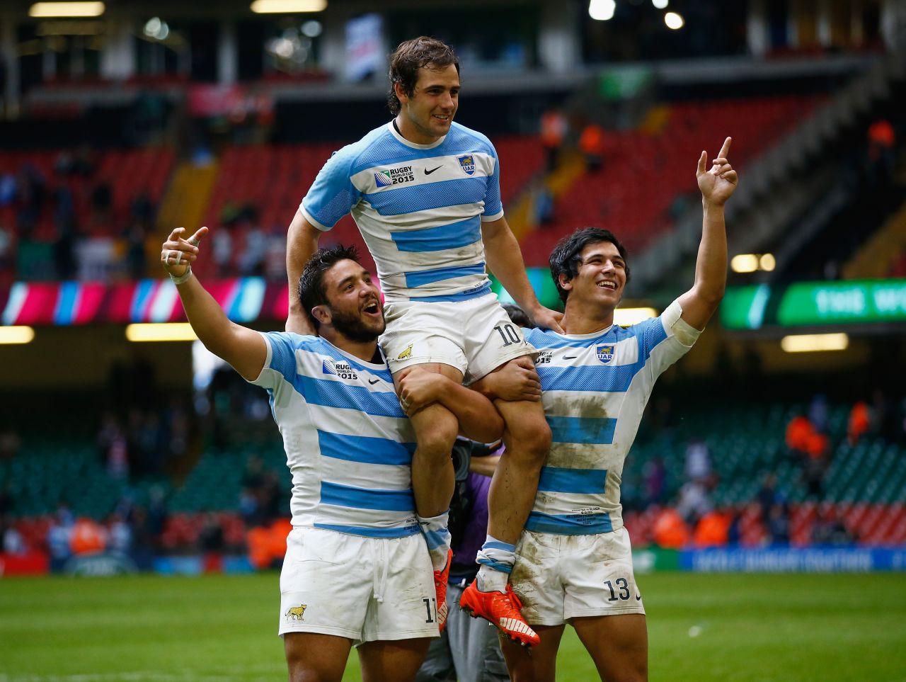 Nicolas Sanchez is lifted on the shoulders of his Argentina teammates Lucas Noguera and Matias Moroni after a superb victory over Ireland.  