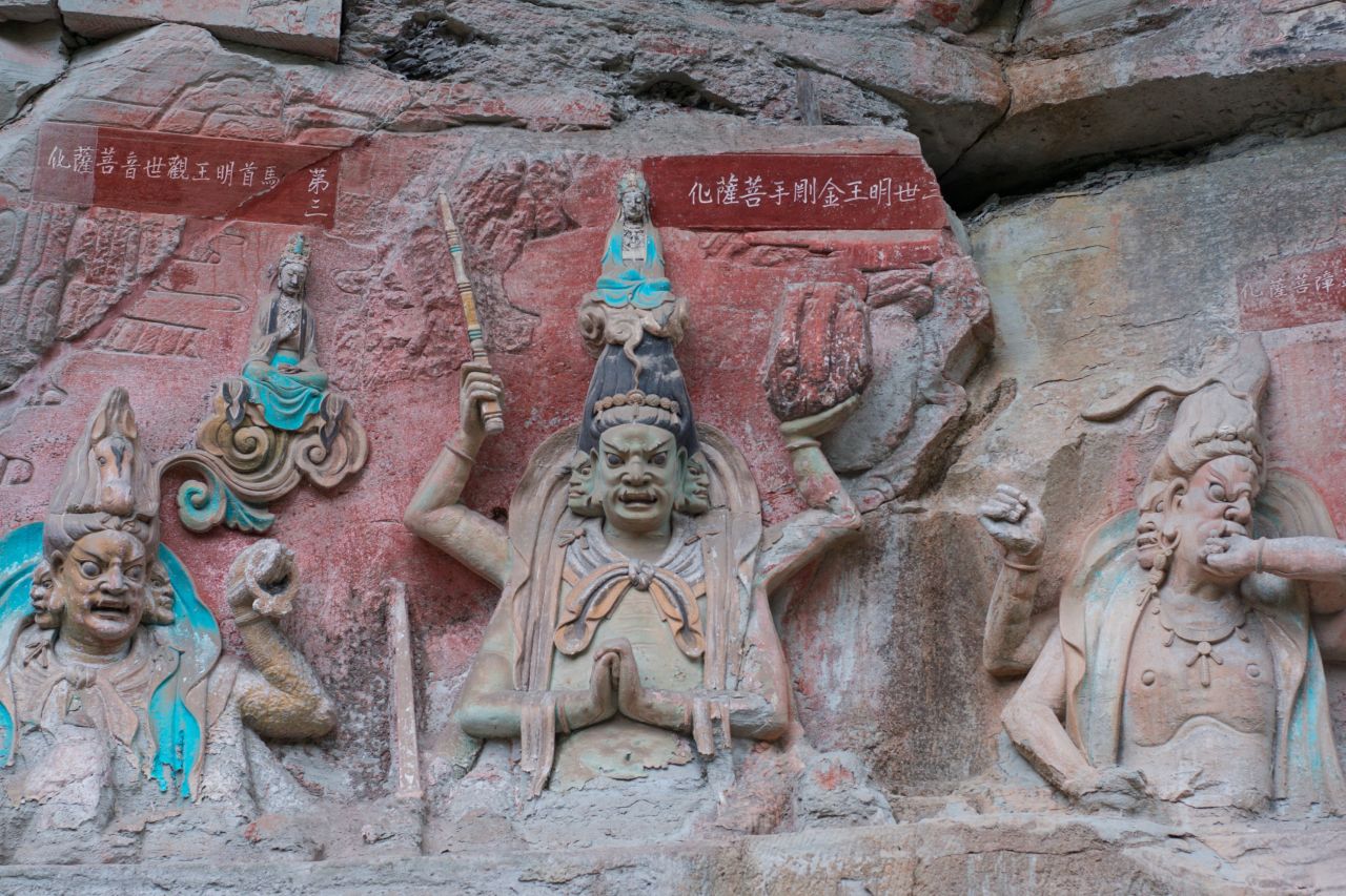 The Dazu District is located in Chongqing. The Dazu Rock Carvings, which date back to the 9th century, are designated as a UNESCO heritage site. The artwork shows a fusion of Buddhist, Taoist and Confucian beliefs.