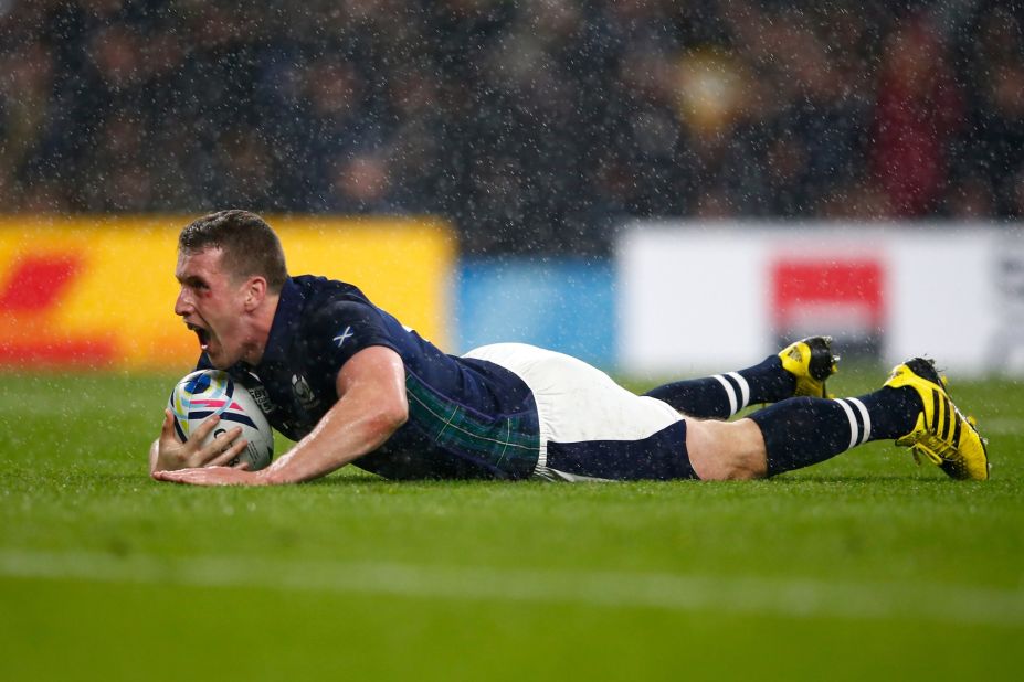 Mark Bennett of Scotland scores his team's third try as it takes a 34-32 lead over Australia in the Rugby World Cup quarterfinal match at Twickenham. 