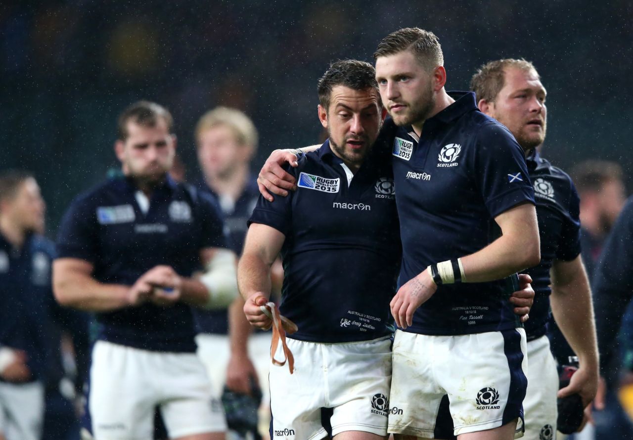 Greig Laidlaw and Finn Russell of Scotland trudge off after their 35-34 defeat to Australia.