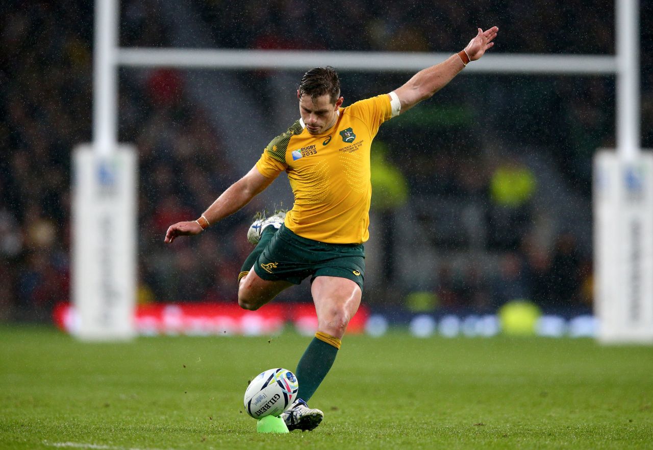 Bernard Foley kicks the match winning penalty for Australia during its one-point victory over Scotland at Twickenham.