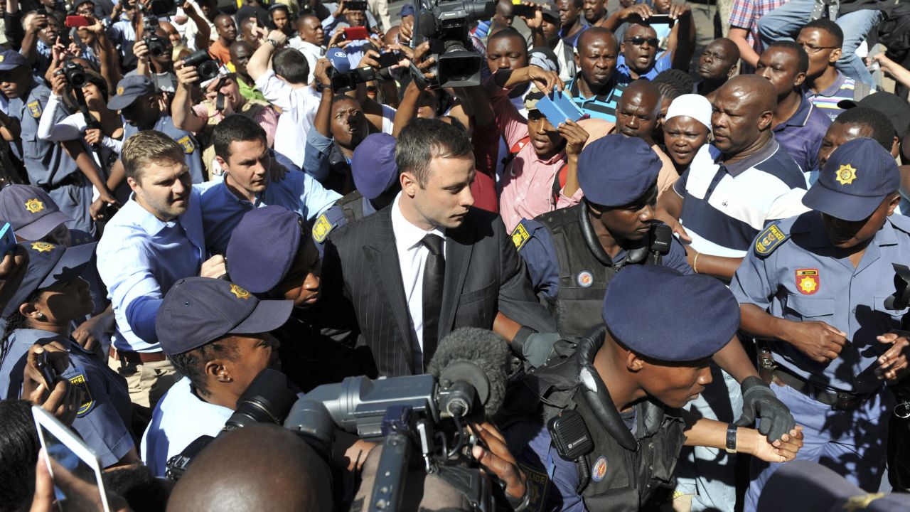 Pistorius arrives outside a courtroom in Pretoria in October 2014. He was initially convicted of culpable homicide and sentenced to five years in prison, but a higher court reversed it to murder after an appeal.