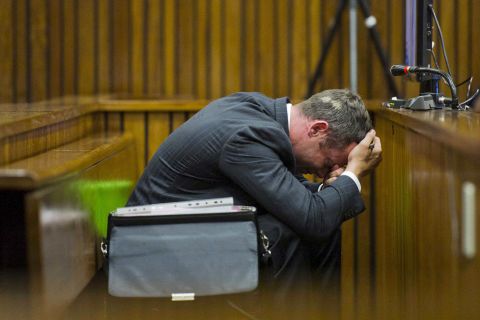 Pistorius puts his head in his hands during his trial in South Africa in March 2014. Pistorius often showed great emotion as the court went into detail about Steenkamp's death.