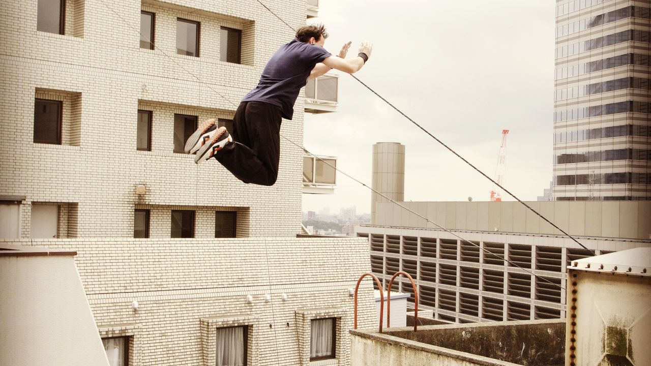 Parkour instructor Dan Edwardes take a spectacular leap in Tokyo.
