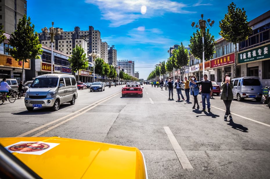 Cultural shock: Everybody, yes everybody, has a smartphone in China, even in the most remote areas. They seem to love classic cars, and the blond drivers in particular for some reason. A red Ferrari drove ahead of us.<br />