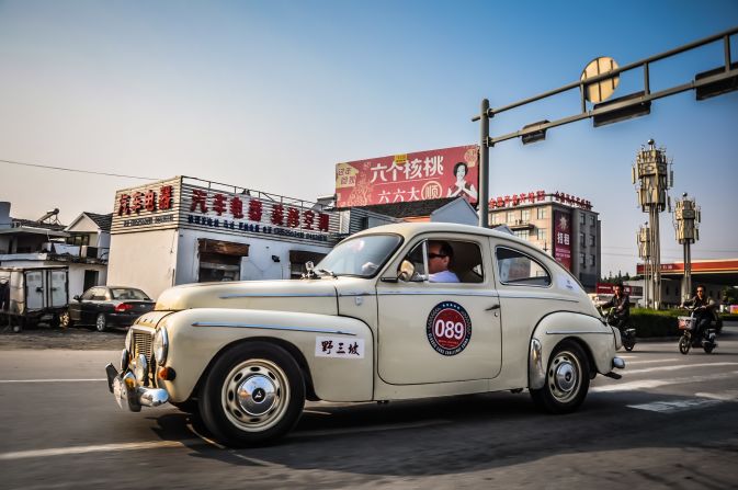 A 1954 Volve P544 drives through a small town enroute to Suzhou. 