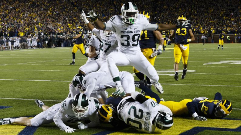 Michigan State players crash into the end zone after Jalen Watts-Jackson <a  target="_blank" target="_blank">scored an improbable touchdown</a> to defeat Michigan on Saturday, October 17. Michigan looked to have the game in hand until fumbling on a punt play with 10 seconds left. Watts-Jackson returned the ball for a 27-23 victory.