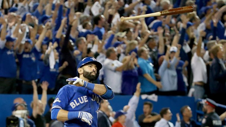 Toronto slugger Jose Bautista <a href="index.php?page=&url=http%3A%2F%2Fbleacherreport.com%2Farticles%2F2579271-jose-bautista-hammers-go-ahead-3-run-homer-vs-rangers-epically-throws-bat" target="_blank" target="_blank">flips his bat</a> Wednesday, October 14, after hitting a go-ahead home run in Game 5 of the American League Division Series. Toronto defeated Texas 6-3 and advanced to the next round of the playoffs.