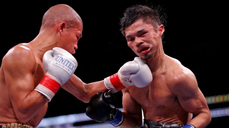 Koki Kameda punches Kohei Kono during their super-flyweight bout in Chicago on Friday, October 16. Kono won by unanimous decision, however, to retain his WBA world title. Kameda retired after the fight.