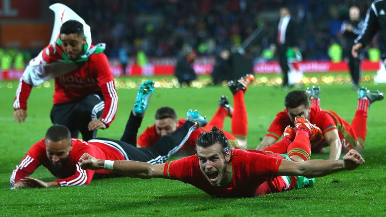 Soccer star Gareth Bale, front, and his Welsh teammates celebrate in front of their home fans after defeating Andorra 2-0 on Tuesday, October 13. It was their first home game since qualifying for Euro 2016, which will be Wales' first major tournament since the 1958 World Cup.