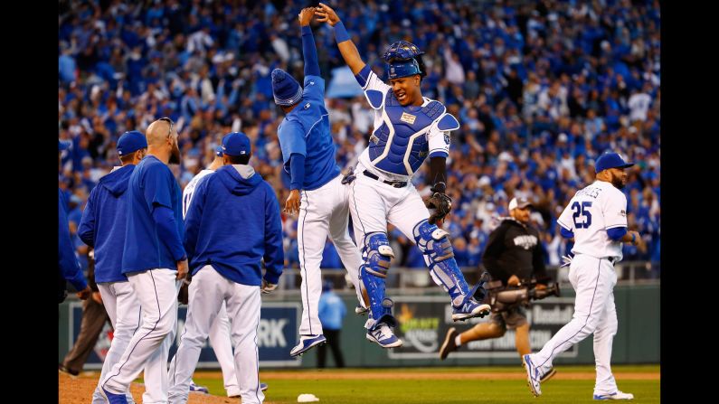 Kansas City catcher Salvador Perez high-fives a teammate after the Royals won Game 2 of the American League Championship Series on Saturday, October 17. Kansas City, last year's American League champions, took a 2-0 series lead against Toronto.