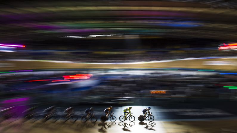 In this photo, shot using a slow shutter speed, cyclists compete in London on Sunday, October 18.