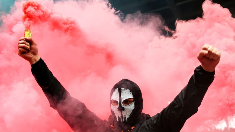 A fan of soccer club Spartak Moscow holds a flare during a match against Lokomotiv Moscow on Sunday, October 18.