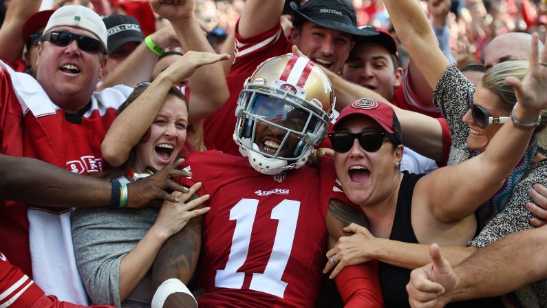 San Francisco wide receiver Quinton Patton celebrates with fans after catching a touchdown against Baltimore on Sunday, October 18. Patton and the 49ers won 25-20 for their second victory of the season.