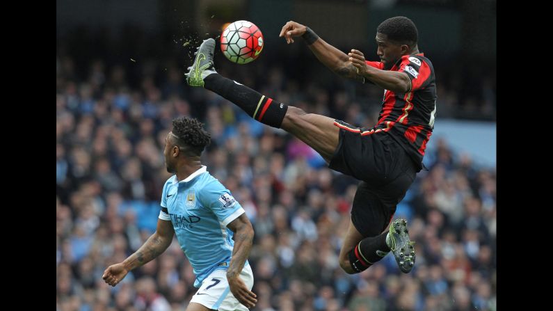 Bournemouth defender Sylvain Distin leaps for a kick during a Premier League match in Manchester, England, on Saturday, October 17.
