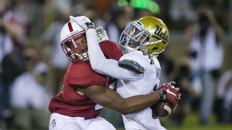 Stanford wide receiver Francis Owusu pins the ball against UCLA's Jaleel Wadood as he pulls in an amazing touchdown catch Thursday, October 15, in Palo Alto, California. <a href="index.php?page=&url=http%3A%2F%2Fbleacherreport.com%2Farticles%2F2579704-stanford-wr-francis-owusu-makes-the-catch-of-the-year" target="_blank" target="_blank">See video of what many are calling the catch of the year</a>