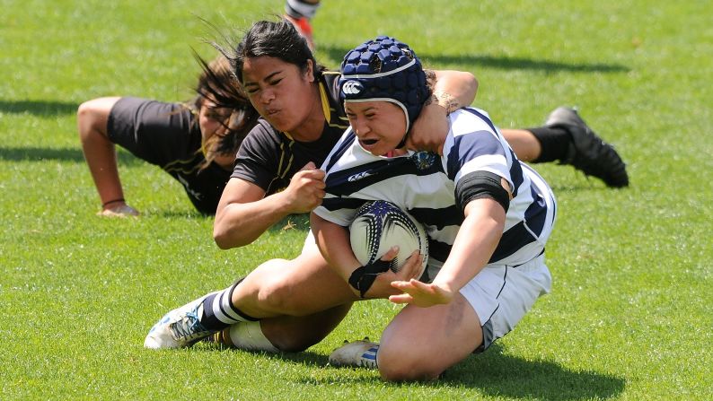 Auckland's Charmaine McMenamin is tackled while playing Wellington in the Provincial Championship final played Saturday, October 17, in Napier, New Zealand. Auckland won 39-9.