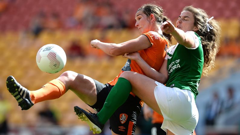 Brisbane's Ruth Blackburn, left, is challenged by Canberra's Jenna McCormick during a W-League match in Brisbane, Australia, on Sunday, October 18.