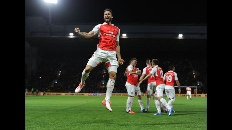 Arsenal striker Olivier Giroud pumps his fist after scoring against Watford in a Premier League match played Saturday, October 17, in Watford, England. Arsenal won the match 3-0. <a href="index.php?page=&url=http%3A%2F%2Fwww.cnn.com%2F2015%2F10%2F13%2Fsport%2Fgallery%2Fwhat-a-shot-sports-1013%2Findex.html" target="_blank">See 39 amazing sports photos from last week</a>