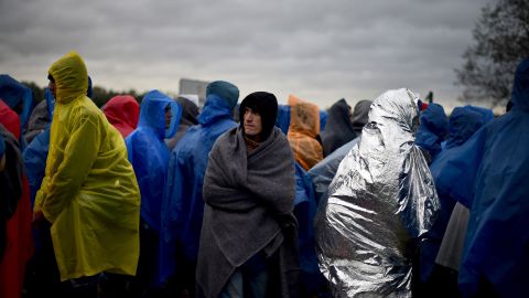 Migrants waited in the rain at the Trnovec border crossing in Croatia on Monday. Amnesty International described the conditions there as "dire."