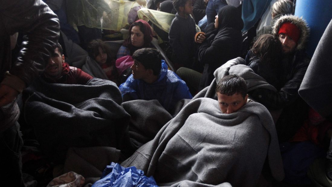 Migrants resting in Trnovec on Monday. Amnesty International criticized governments in the region for allowing the crisis to develop.