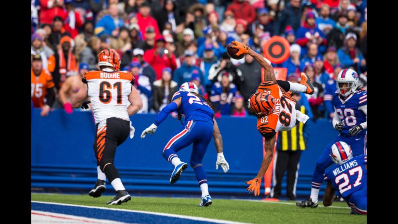 Cincinnati wide receiver Marvin Jones flips into the end zone after being hit by Buffalo's Duke Williams on Sunday, October 18. Jones had nine catches for 95 yards as the Bengals improved to 6-0 on the season.