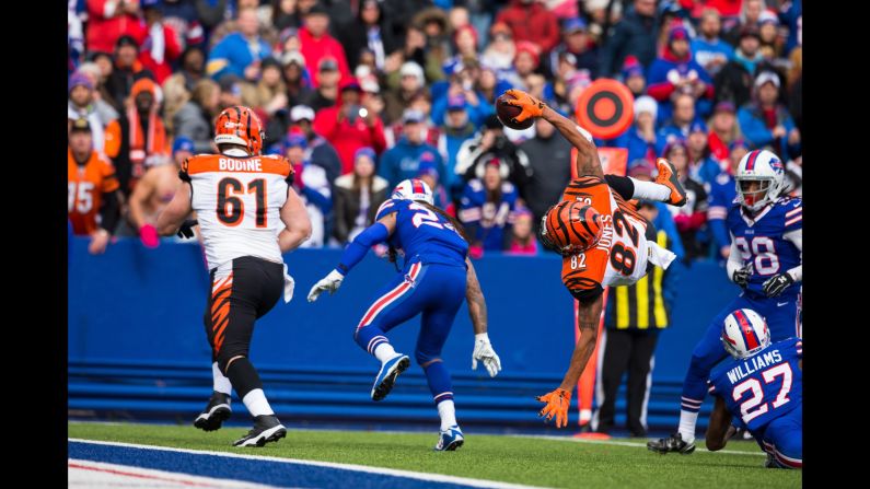 Cincinnati wide receiver Marvin Jones flips into the end zone after being hit by Buffalo's Duke Williams on Sunday, October 18. Jones had nine catches for 95 yards as the Bengals improved to 6-0 on the season.