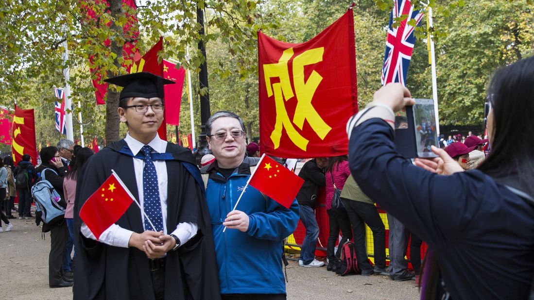 China supporters pose for a picture in London on October 20.