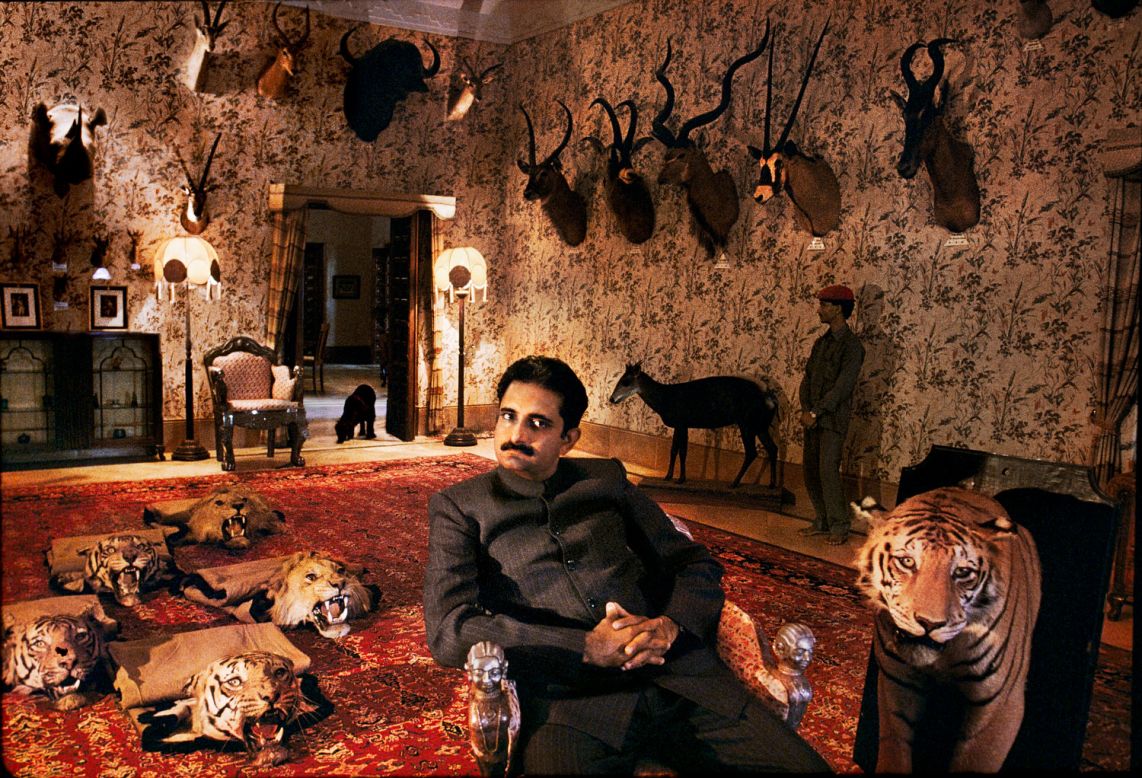 The water-soaked couple couldn't be more removed from this other-worldly 1996 image of Harshvardhan Singh, son of the  Maharawal of Dungarpur, relaxing at home surrounded by a vast array of exotic taxidermy animals.<br /><br />"McCurry's work represents a genuine panorama of the country, from the Rajasthan desert dust storms to monsoon-flooded Bengali villages, from Kashmir to Kerala," says Dalrymple.<br /><br />"His is a world of limpid light, burning colors and darkest shadow, in mood both melancholy and festive. From the massed crowds of Kumbh to a lone woodsman in the Himalayan forest, all Indian humanity is here."