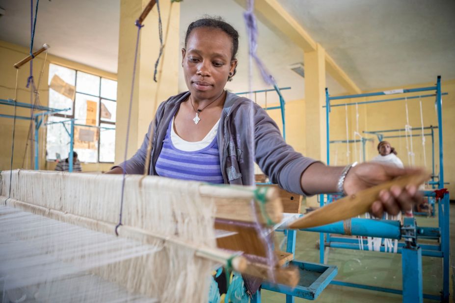 Weavers from Ethiopia's rural villagers work to produce Mahlet Afework's designs. The clothes will go on to be featured at fashion shows around the world. 